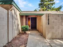 Inviting front entrance with a secure door and well-maintained landscaping at 17838 N 45Th Ave, Glendale, AZ 85308