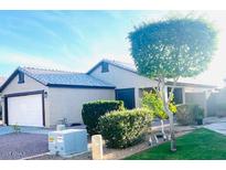 Charming single-story home featuring a two-car garage and well-manicured landscaping at 2618 S 81St Ln, Phoenix, AZ 85043