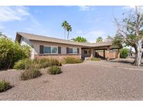 Charming single-story home featuring a well-kept front yard and convenient carport at 2902 E Corrine Dr, Phoenix, AZ 85032