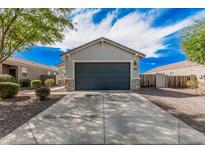 Charming single-story home with a well-maintained front yard and a two-car garage in a suburban neighborhood at 3907 E Archer Dr, San Tan Valley, AZ 85140