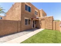 Charming home exterior with artificial turf, walkway, and convenient front-door parking at 4218 S 46Th Pl, Phoenix, AZ 85040