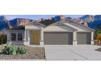 Charming single-story home featuring a 3-car garage and desert landscaping at 5865 E Axle Ln, San Tan Valley, AZ 85140