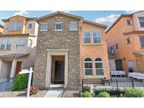 Charming home featuring a stone facade, open porch, and manicured landscaping at 7734 W Terri Lee Dr, Phoenix, AZ 85035