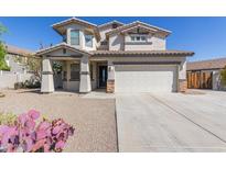 Charming two-story home with a two-car garage and desert landscaping at 15324 W Windsor Ave, Goodyear, AZ 85395