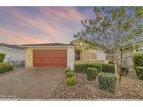 Charming single-Gathering home with a two-car garage and manicured landscaping at 22560 E Rosa Rd, Queen Creek, AZ 85142