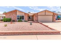 Charming single-story home with low maintenance desert landscaping in front yard at 4245 E Yawepe St, Phoenix, AZ 85044