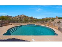 Sparkling pool features pristine blue water and offers stunning views of the surrounding desert landscape at 11856 E Parkview Ln, Scottsdale, AZ 85255