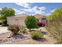 Charming single-story home with desert landscaping and colorful flowering bushes at 16836 E Mirage Crossing Ct # B, Fountain Hills, AZ 85268