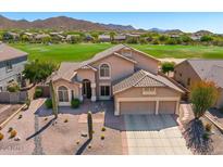 Charming two-story home featuring a three-car garage, desert landscaping, and picturesque mountain views at 3601 N Sonoran Hts, Mesa, AZ 85207