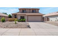 Charming two-story home with desert landscaping, a tile roof, and a two-car garage in a residential neighborhood at 3900 S Velero St, Chandler, AZ 85249