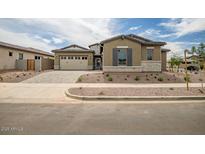 Beautiful single-Gathering home featuring a three-car garage and low-maintenance landscaping at 9705 E Sector Dr, Mesa, AZ 85212