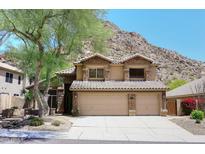Charming two-story home with a three-car garage, stone accents, and mountain views at 14833 S 14Th Pl, Phoenix, AZ 85048