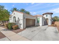 Charming single-Gathering home with a two-car garage, desert landscaping, and a welcoming front entrance at 7936 S 7Th Way, Phoenix, AZ 85042