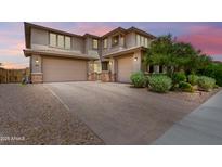 Charming two-story home featuring a spacious driveway and two-car garage, perfect for families at 9342 W White Feather Ln, Peoria, AZ 85383