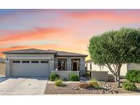 Charming single-story home with a well-maintained front yard and inviting entrance; attached garage and desert landscaping at 17520 W Fairview St, Goodyear, AZ 85338