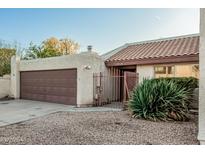Charming single-story home featuring a tile roof and low-maintenance desert landscaping at 1918 S Shannon Dr, Tempe, AZ 85281