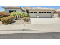 Well maintained single Gathering home featuring a two car garage and desert landscaping at 20608 N 57Th Ave, Glendale, AZ 85308