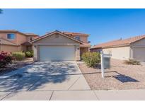Charming single-Gathering home with a two-car garage and low-maintenance desert landscaping, in a residential neighborhood at 22320 W Morning Glory St, Buckeye, AZ 85326