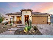 Charming home featuring desert landscaping, a clay tile roof, and a welcoming entrance at 27021 W Kerry Ln, Buckeye, AZ 85396