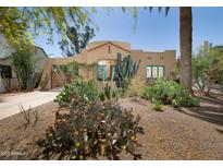 Charming single-story home featuring desert landscaping, a clay tile roof, and turquoise window trim at 39 E Hoover Ave, Phoenix, AZ 85004