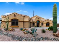 Charming single-story home with desert landscaping, decorative rock, and a private yard at 10040 E Grandview St, Mesa, AZ 85207