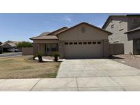 Charming single-story home featuring a tile roof and a spacious two-car garage at 12505 W Adams St, Avondale, AZ 85323