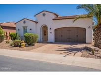 Charming home featuring a desert landscaped front yard, arched entryway, and a two-car garage at 1787 E Sattoo Way, Queen Creek, AZ 85140