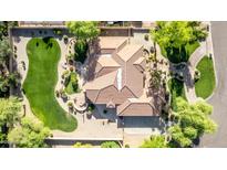 Expansive aerial view of a house featuring a putting green, tiled roof, and meticulously landscaped surroundings at 2641 E Birchwood Pl, Chandler, AZ 85249