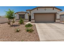 Charming single-Gathering home featuring a two-car garage and a low maintenance desert landscaped front yard at 37008 N Hinterwald Way, San Tan Valley, AZ 85143