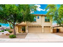 Charming two-story home with a desert landscaped yard and a spacious two-car garage at 1036 E Magnum Rd, San Tan Valley, AZ 85140