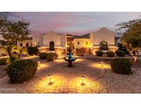 Stunning home featuring desert landscaping, a brick walkway, and a fountain at 18226 W Marshall Ct, Litchfield Park, AZ 85340