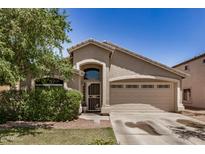 Charming single-story home featuring a well-maintained front yard and two-car garage at 2727 S 160Th Ln, Goodyear, AZ 85338