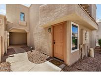 Welcoming condo exterior with a charming entryway featuring a cozy front door and well maintained landscaping at 2834 S Extension Rd # 2001, Mesa, AZ 85210