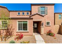 Charming two-story home with a low maintenance front yard and covered entryway at 8244 W Albeniz Pl, Phoenix, AZ 85043
