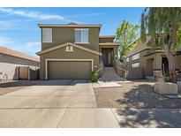 Charming two-story home with a two car garage and a welcoming elevated front entryway at 1281 E Frances Ln, Gilbert, AZ 85295