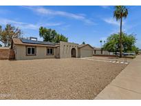 Charming single-story home featuring a well-kept exterior and desert-friendly landscaping at 14215 N 36Th Way, Phoenix, AZ 85032