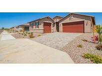 Beautiful single-Gathering home with a two-car garage and a well-maintained front yard and a driveway at 25221 N 131St Dr, Peoria, AZ 85383