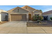 Charming single-story home featuring a two-car garage, desert landscaping, and a cozy front porch at 2629 E Hidalgo Ave, Phoenix, AZ 85040