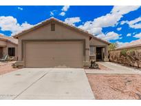 Charming single-story home with a two-car garage and low-maintenance desert landscaping at 12034 W Aster Dr, El Mirage, AZ 85335