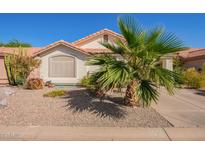 Charming home featuring a desert landscape, a red tiled roof, and a mature palm tree in the front yard at 1803 E Palm Beach Dr, Chandler, AZ 85249