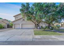 Charming two-story home with a three-car garage and mature trees in a well-maintained neighborhood at 3761 W Kent Dr, Chandler, AZ 85226
