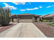 Charming single-story home with a well-manicured front yard and a two-car garage at 10152 E Knowles Ave, Mesa, AZ 85209