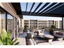 Outdoor rooftop patio area with seating, grill, and modern pergola, great for entertaining at 19360 N 73Rd St # 1068, Scottsdale, AZ 85255