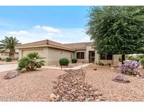 Charming single-story home with desert landscaping, rock accents, and a tiled roof at 20450 N Shadow Mountain Dr, Surprise, AZ 85374