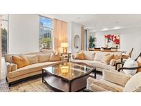 Bright and airy living room with comfortable seating and views of the city at 2402 E Esplanade Ln # 204, Phoenix, AZ 85016
