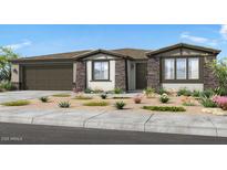 Single-story home with stone accents, desert landscaping, and a two-car garage at 39514 N Kaden Ln, San Tan Valley, AZ 85140