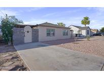 Charming single-story home featuring a gated entry and low-maintenance landscaping at 432 W 1St St, Mesa, AZ 85201