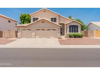 Charming two-story home with a three-car garage and well-maintained landscaping at 4746 W Taro Dr, Glendale, AZ 85308