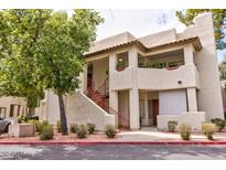 Charming condo complex with terra cotta tile roof and private patios in a lush, green community at 750 E Northern E Ave # 2145, Phoenix, AZ 85020