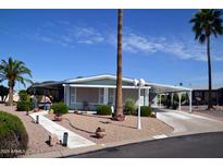 Charming single-story home with covered parking and desert landscaping at 8310 E Deep Canyon Ct, Mesa, AZ 85208